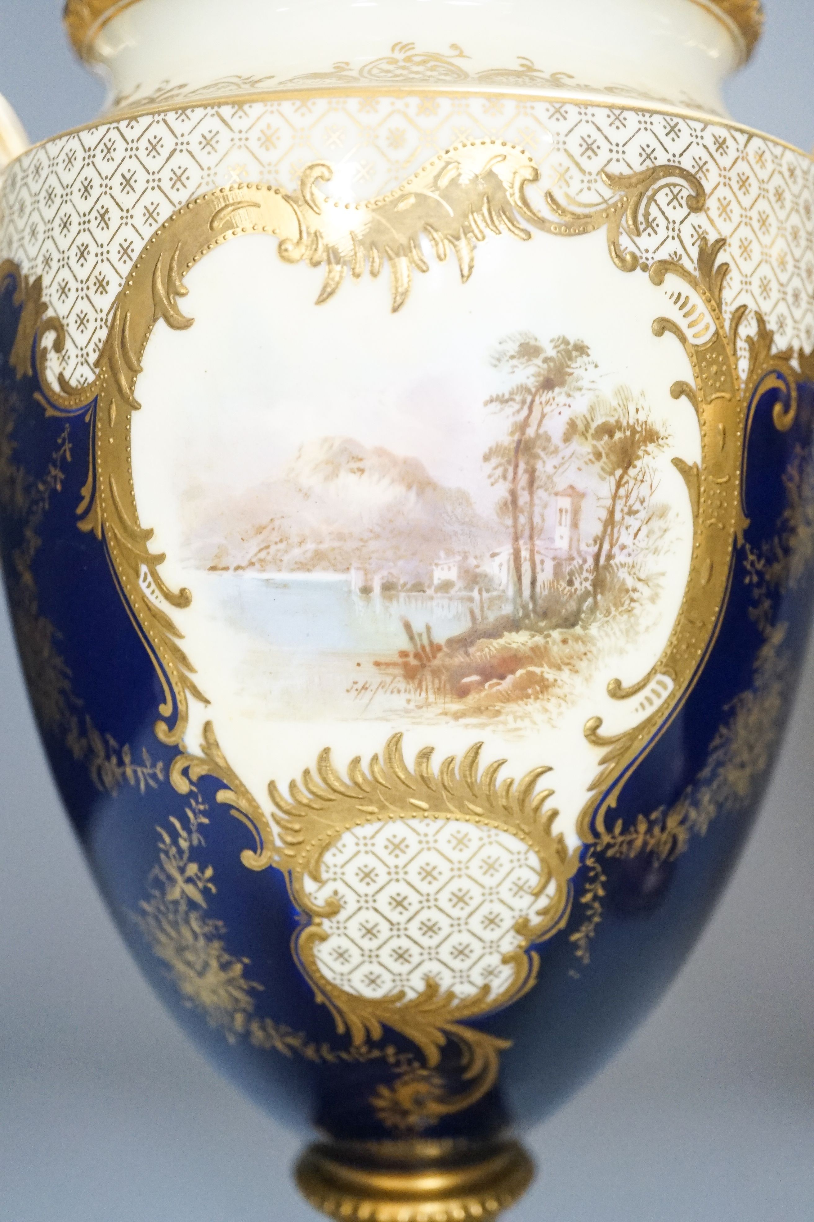 A pair of large Coalport landscape painted vases and covers, c.1900, 30cm